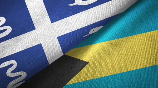 Martinique serpente e Bahamas duas bandeiras de pano têxtil, textura de tecido — Fotografia de Stock