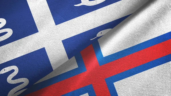 Martinica serpiente y las Islas Feroe dos banderas tela textil, textura de la tela —  Fotos de Stock
