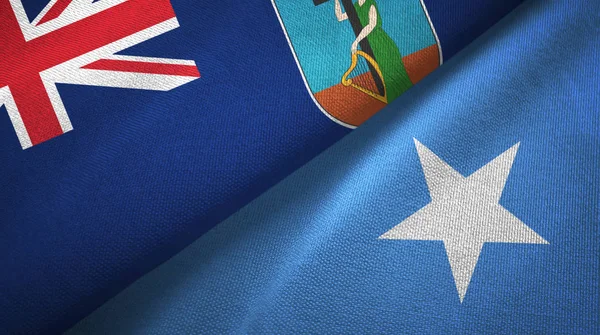 Montserrat y Somalia dos banderas tela textil, textura de la tela — Foto de Stock