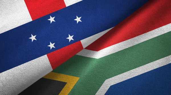 Niederländische Antillen und Südafrika zwei Flaggen Textilstoff, Textur — Stockfoto