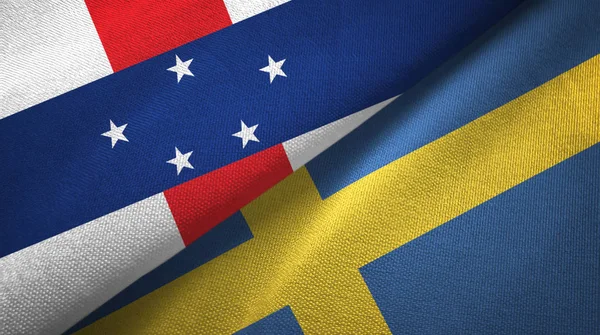 Antillas Neerlandesas y Suecia dos banderas tela textil, textura de la tela —  Fotos de Stock