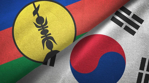 Nová Kaledonie a Jižní Korea textilní tkanina se dvěma vlajkami, textura tkaniny — Stock fotografie