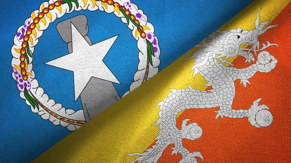 Islas Marianas del Norte y Bután dos banderas tela textil, textura de la tela — Foto de Stock