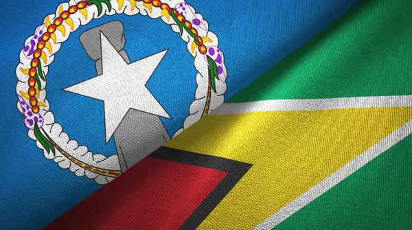 Islas Marianas del Norte y Guyana dos banderas tela textil, textura de la tela — Foto de Stock