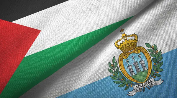 Palestina y San Marino dos banderas tela textil, textura de la tela — Foto de Stock