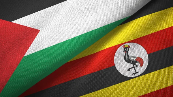 Palestyna i Uganda dwie flagi tkaniny tekstylne, tekstura tkaniny — Zdjęcie stockowe