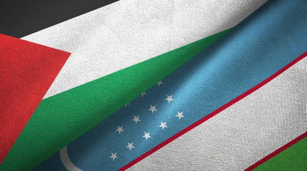 Palestina y Uzbekistán dos banderas tela textil, textura de la tela — Foto de Stock