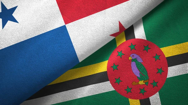 Panama en Dominica twee vlaggen textiel doek, stof textuur — Stockfoto