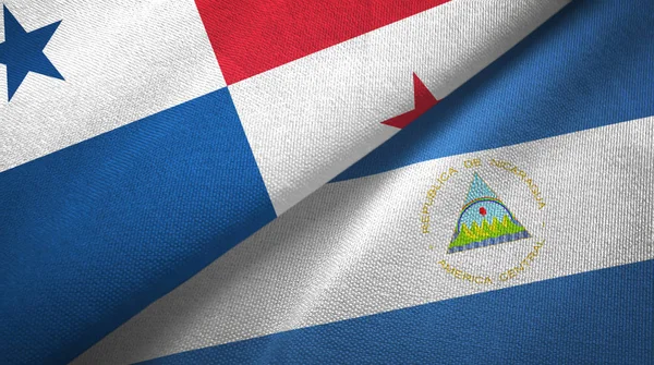 Panamá e Nicarágua duas bandeiras de pano têxtil, textura de tecido — Fotografia de Stock