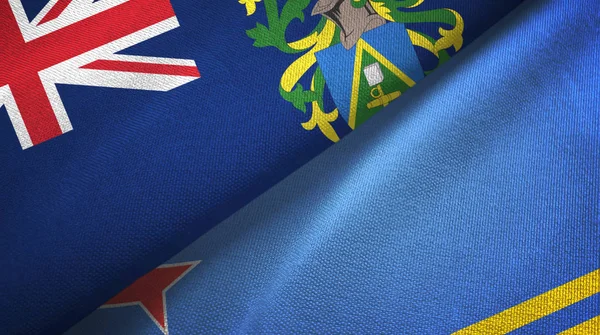 Pitcairn Islands and Aruba two flags textile cloth, fabric texture — 图库照片