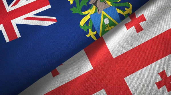 Islas Pitcairn y Georgia dos banderas tela textil, textura de la tela — Foto de Stock
