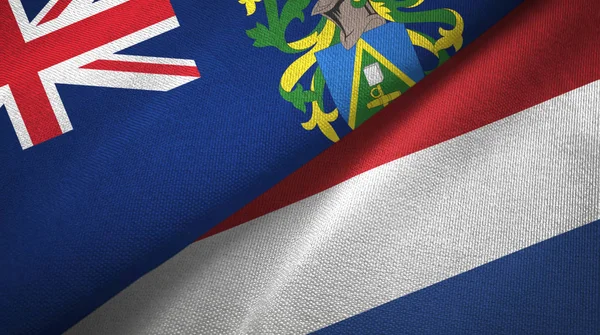 Піткернські острови та Нідерланди Два прапори текстильної тканини, текстура тканини — стокове фото