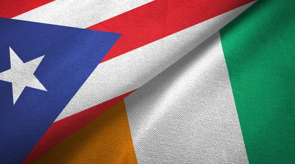 Puerto Rico en Ivoorkust Ivoorkust twee vlaggen textiel textuur — Stockfoto