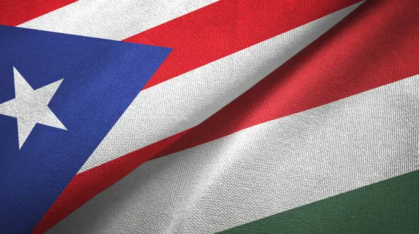 Puerto Rico en Hongarije twee vlaggen textiel doek, stof textuur — Stockfoto
