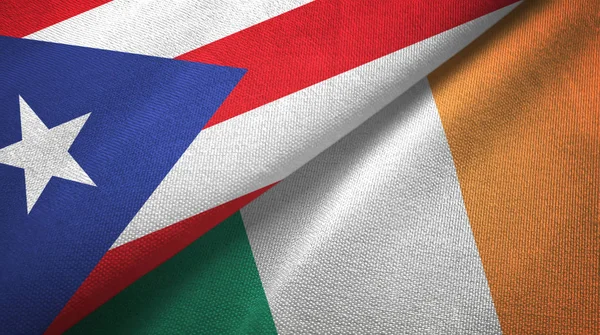 Puerto Rico en Ierland twee vlaggen textiel doek, stof textuur — Stockfoto