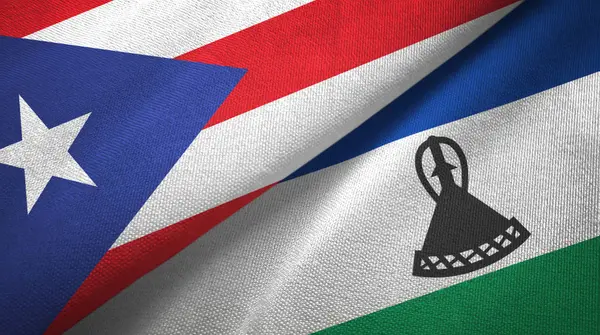 Puerto Rico en Lesotho twee vlaggen textiel doek, stof textuur — Stockfoto