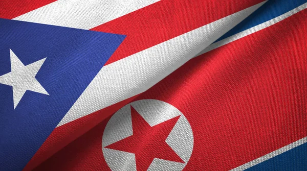 Puerto Rico and North Korea two flags textile cloth, fabric texture — 图库照片