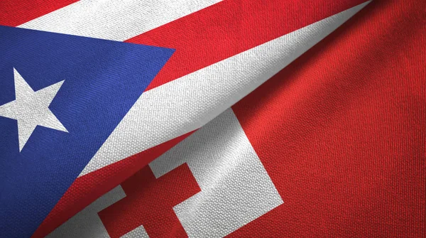 Puerto Rico y Tonga dos banderas de tela textil, textura de tela —  Fotos de Stock