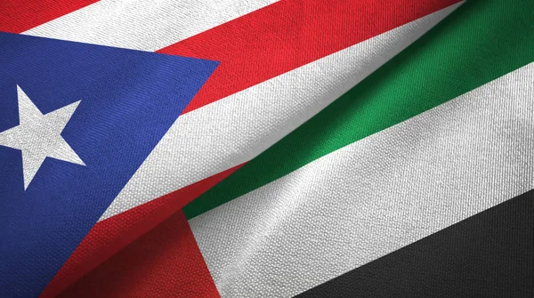 Puerto Rico en de Verenigde Arabische Emiraten twee vlaggen textiel doek, stof textuur — Stockfoto