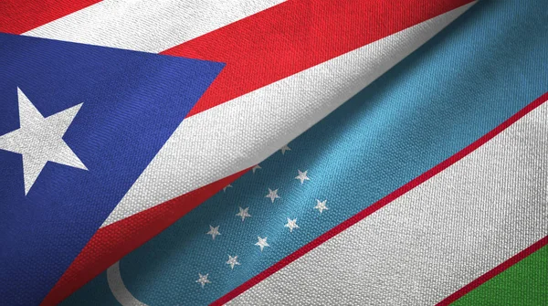 Puerto Rico en Oezbekistan twee vlaggen textiel doek, stof textuur — Stockfoto