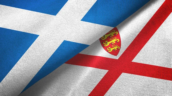 Escócia e Jersey duas bandeiras de pano têxtil, textura de tecido — Fotografia de Stock