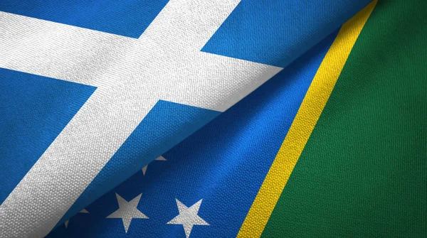 Scotland and Solomon Islands two flags textile cloth, fabric texture