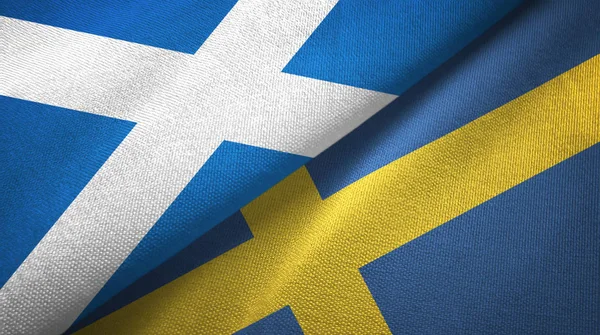 Escocia y Suecia dos banderas tela textil, textura de la tela —  Fotos de Stock