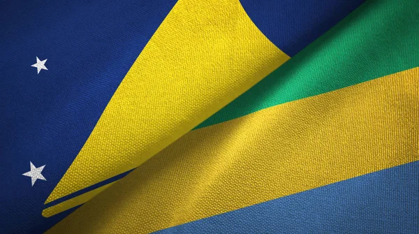 Tokelau a Gabon dvě vlajky textilní tkaniny, textura tkaniny — Stock fotografie