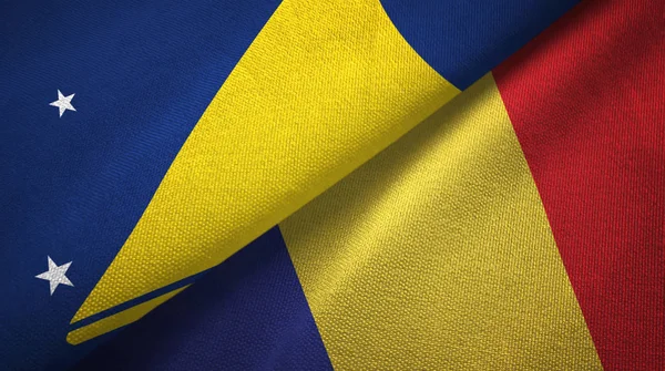 Tokelau en Roemenië twee vlaggen textiel doek, stof textuur — Stockfoto