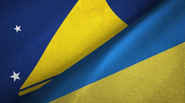 Tokelau y Ucrania dos banderas tela textil, textura de la tela —  Fotos de Stock