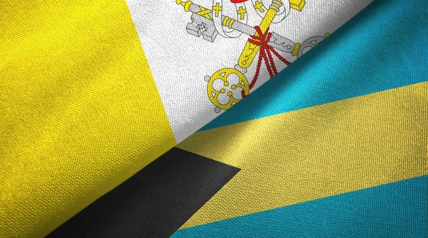 Watykan i Bahamy dwie flagi tkaniny tekstylne, tekstura tkaniny — Zdjęcie stockowe