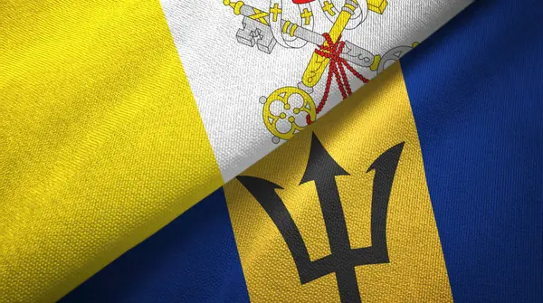 Watykan i Barbados dwie flagi tkaniny tekstylne, tekstura tkaniny — Zdjęcie stockowe