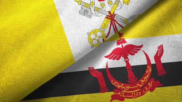 Watykan i Brunei dwie flagi tkaniny tekstylne — Zdjęcie stockowe
