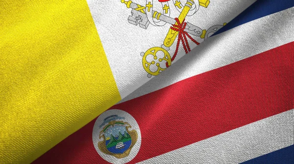 Vatican and Costa Rica two flags textile cloth, fabric texture — стокове фото
