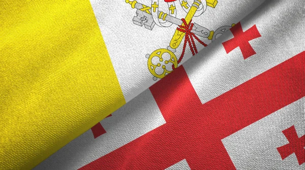 Watykan i Gruzja dwie flagi tkaniny tekstylne, tekstura tkaniny — Zdjęcie stockowe