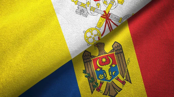 Vatikanen och Moldavien två flaggor textilduk, tyg struktur — Stockfoto