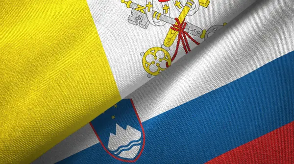 Watykan i Słowenia dwie flagi tkaniny tekstylne, tekstura tkaniny — Zdjęcie stockowe