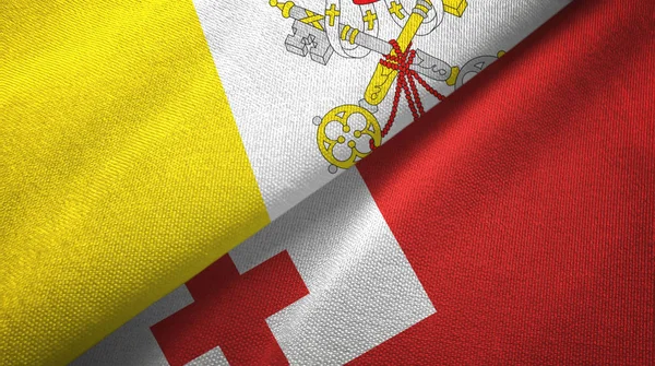 Watykan i Tonga dwie flagi tkaniny tekstylne, tekstura tkaniny — Zdjęcie stockowe