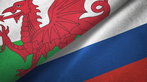 Wales and Russia two flags textile cloth, fabric texture
