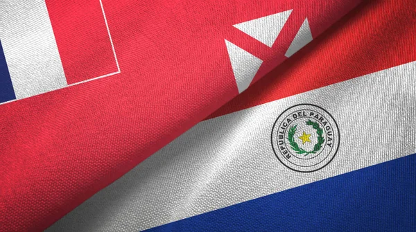 Wallis e Futuna e Paraguay due bandiere tessuto, tessitura del tessuto — Foto Stock