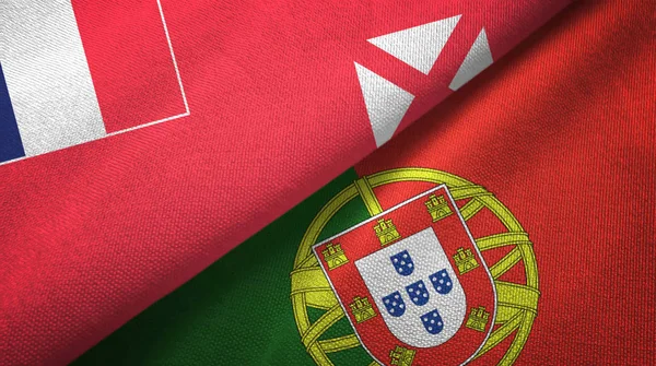 Wallis y Futuna y Portugal dos banderas tela textil, textura de la tela — Foto de Stock