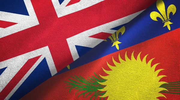 United Kingdom and Guadeloupe two flags textile cloth, fabric texture — Stockfoto