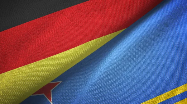 Germania e Aruba due bandiere tessuto, tessitura del tessuto — Foto Stock