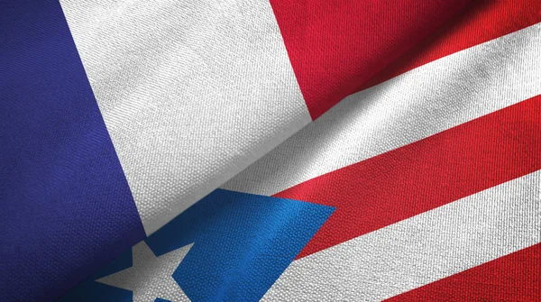 França e Porto Rico duas bandeiras de pano têxtil, textura de tecido — Fotografia de Stock