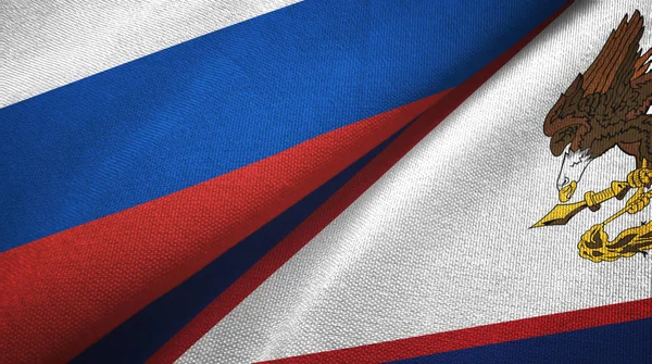 Rusia y Samoa Americana dos banderas tela textil, textura de la tela — Foto de Stock
