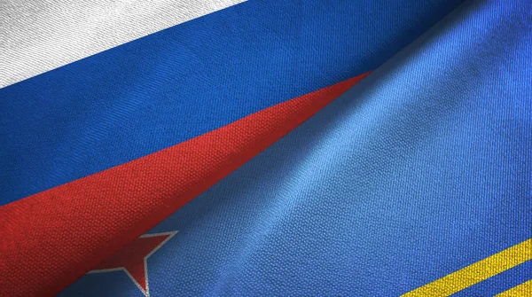 Rusia y Aruba dos banderas tela textil, textura de la tela — Foto de Stock