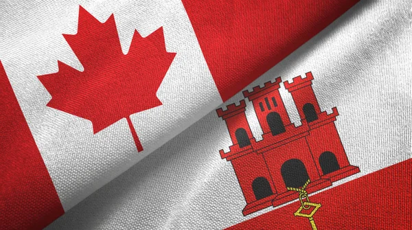 Canada e Gibilterra due bandiere tessuto, tessitura tessuto — Foto Stock