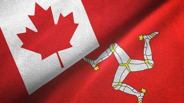 Canadá e Isla de Mann dos banderas tela textil, textura de la tela —  Fotos de Stock