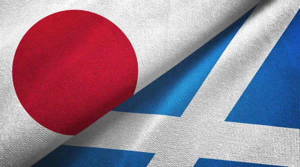 Japonia i Szkocja dwie flagi tkaniny tekstylne, tekstura tkaniny — Zdjęcie stockowe