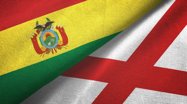 Bolivia och Nordirland två flaggor textilduk, textur — Stockfoto